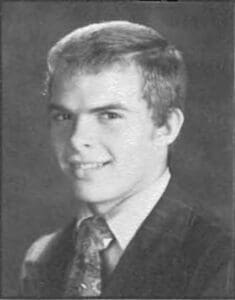 A young man in a suit and tie.