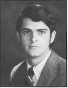 A young man in a suit and tie.