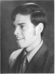 A young man in a suit and tie.