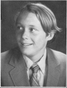 A young man in a suit and tie.